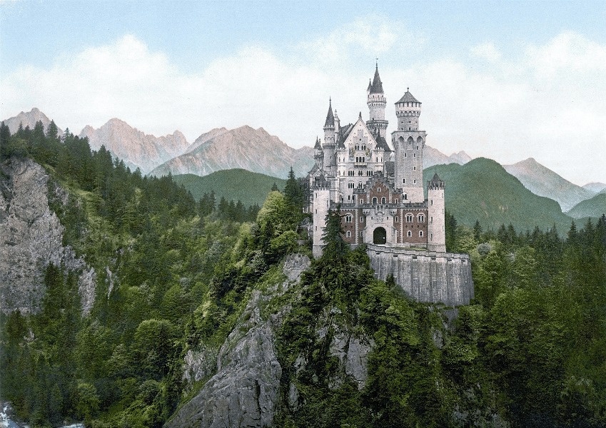 neuschwanstein castle surrounded by mountains